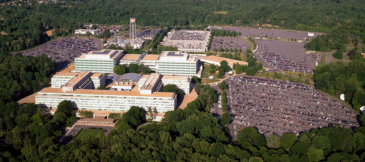 Aerial photograph of CIA headquarters buildings, parking areas and surrounding trees in Langley, Virginia.