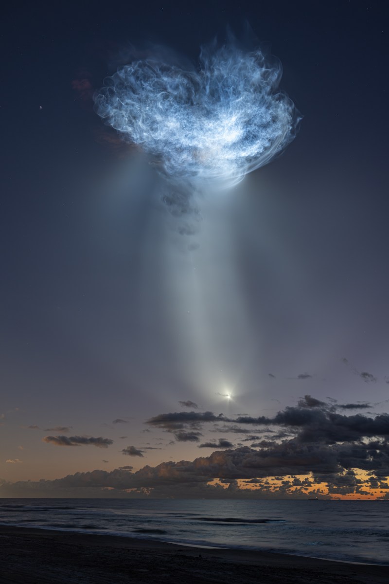 Sunlit rocket exhaust creates a glowing jellyfish-shaped plume during the CRS-35 launch.